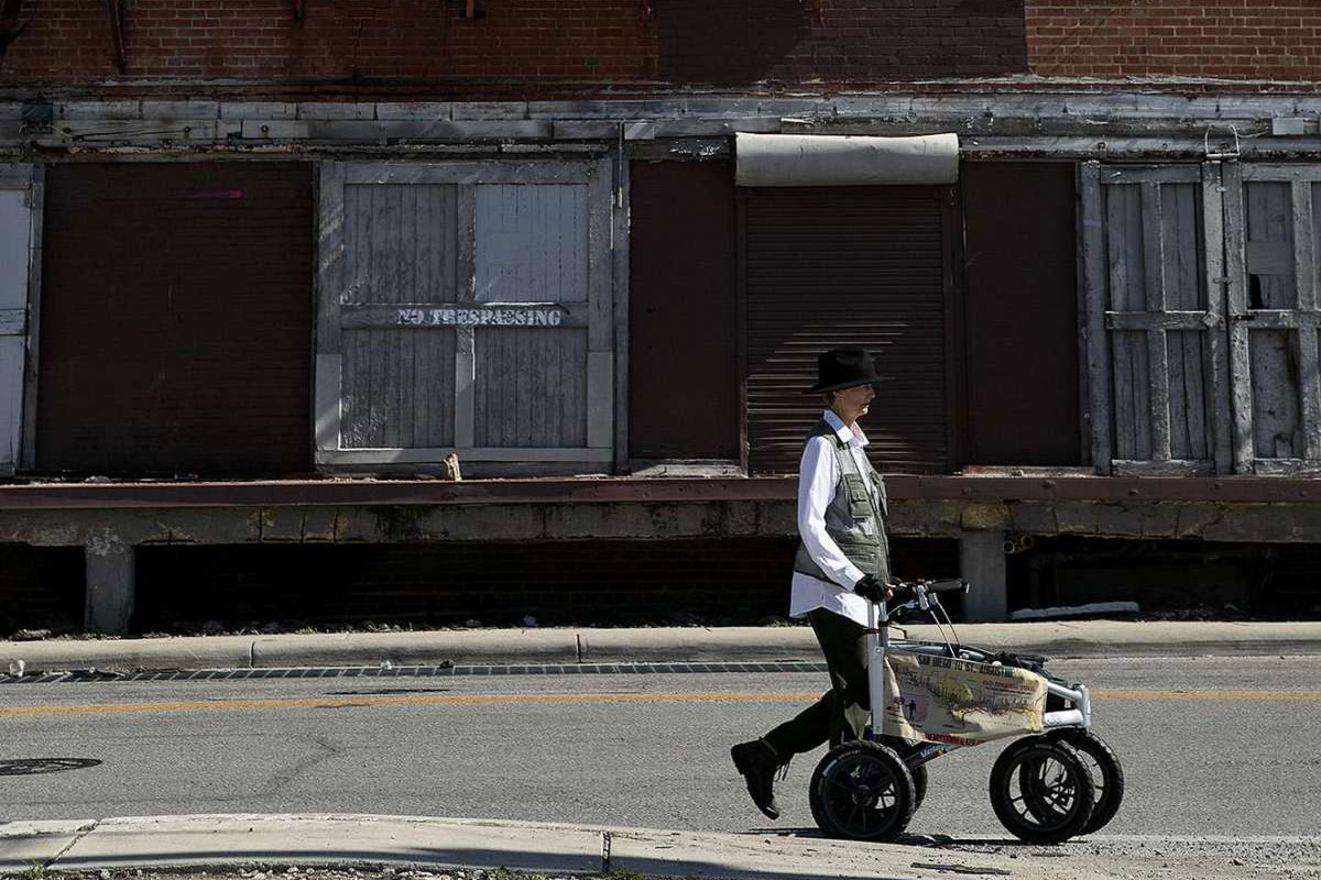 Edie Littlefield Sundby, of San Diego, CA, walks along East Houston Street, following the Old Spanish Trail through San Antonio on May 7, 2021.
